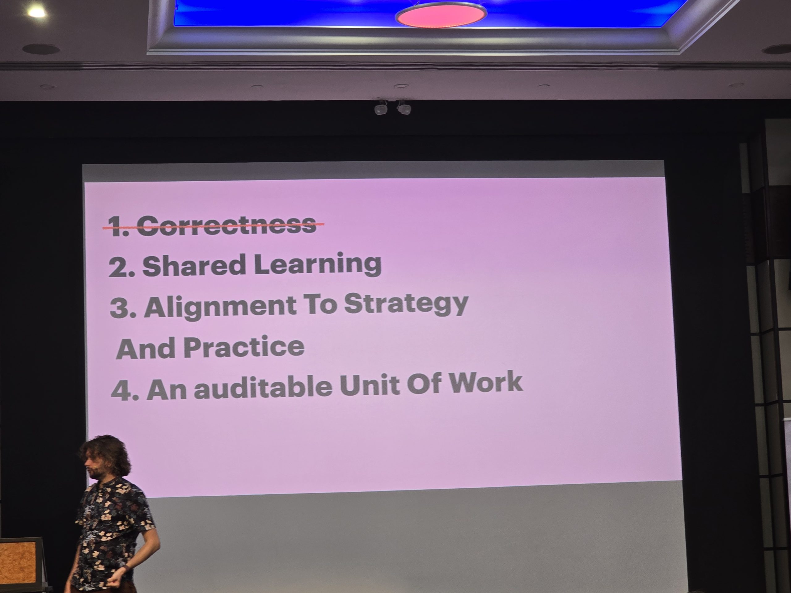 Sam Newman's slide listing the four purposes of a pull request.